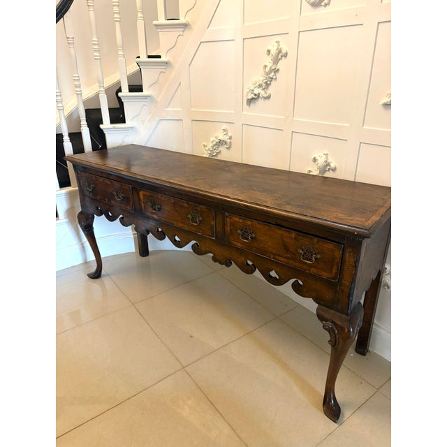 A very attractive oak dresser base of generous proportions and classic Georgian inspired design. The piece has a wonderful...