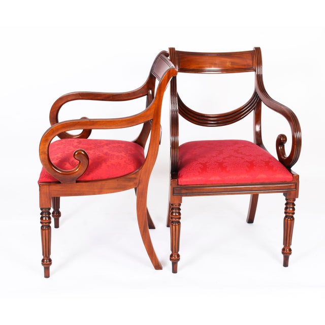 A delightful vintage set of twelve superb swag back dining chairs, dating from the second half of the 20th century....