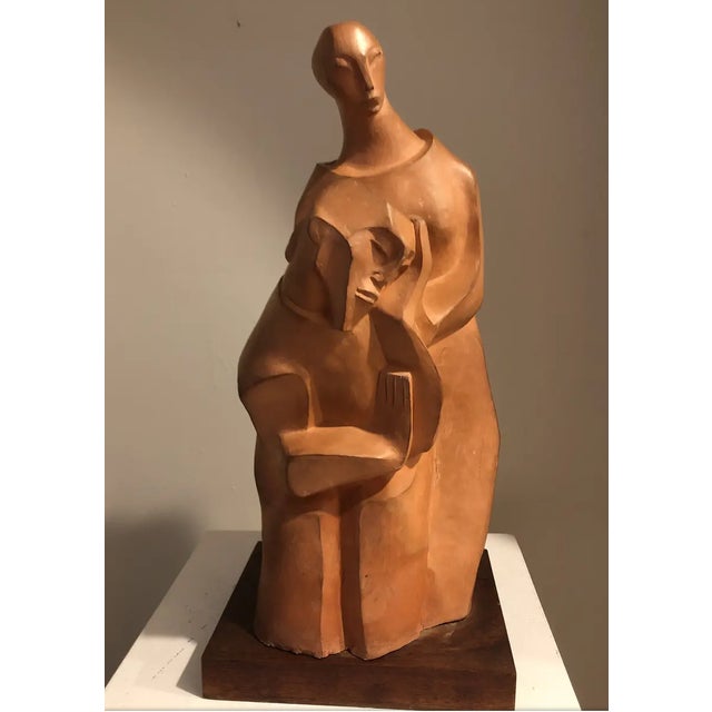 1930s Elsa S Galban (1894-1975) terracotta sculpture of a woman comforting a man. Signed lower side and on a wooden base....