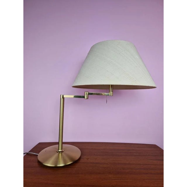 Vintage Swing Arm Table Lamp in Brass from Solken, 1970s, in Very Good conditions. Designed 1960 to 1969 This piece is...