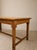 A beautiful, original antique solid wood table, characterized by generous proportions, traditional construction, and a...