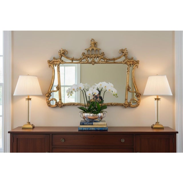 This is an exceptional vintage gilt wall mirror by Friedman Brothers, celebrated for producing some of America's finest...