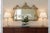 This is an exceptional vintage gilt wall mirror by Friedman Brothers, celebrated for producing some of America's finest...
