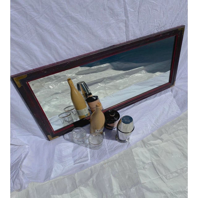 Weighty character of this vintage Lane mirror expressed by a heavily textured oxblood finish and patinated brass corner...