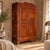 Two-part cherrywood cabinet from Piedmont, dating back to the mid-19th century. It features an elegant front with a pair...