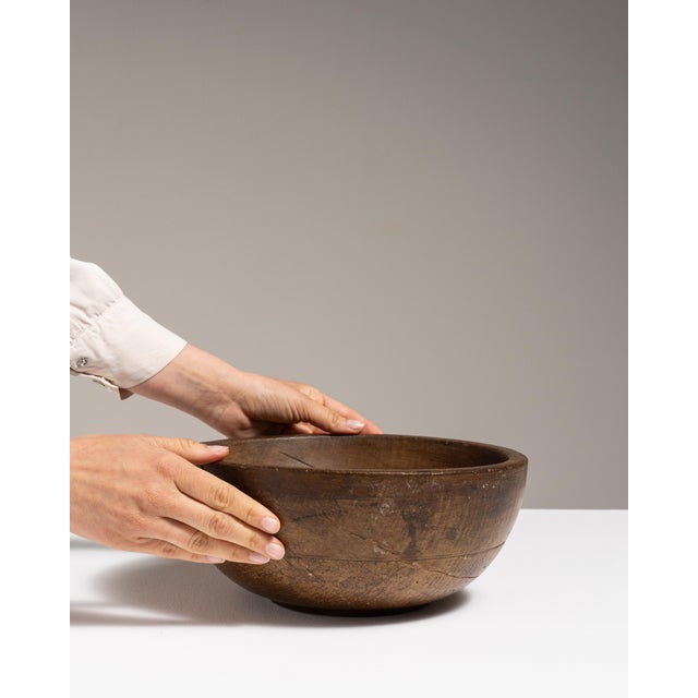 This mid 20th century decorative bowl from Denmark is finished in brown, worked in teak. Its form follows honest, well-...