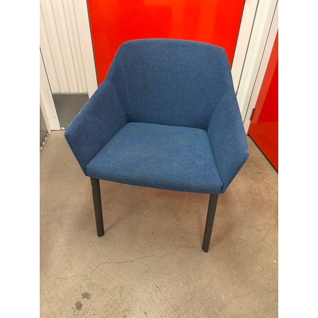 Blue Tweed armchair with tubular black metal legs. Chair has a wrap-around micro-fiber upholstery - beautifully soft to...