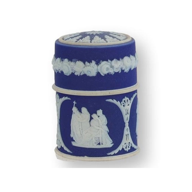Rare antique Wedgwood dip glazed Jasperware match holder in the classic cobalt blue and white colorway. Decorated with...