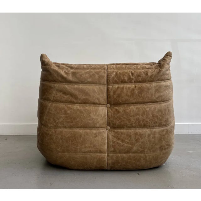 Togo leather armchair. Designed by Michel Ducaroy for Ligne Roset in the 1970s. In very good condition, reupholstered in...