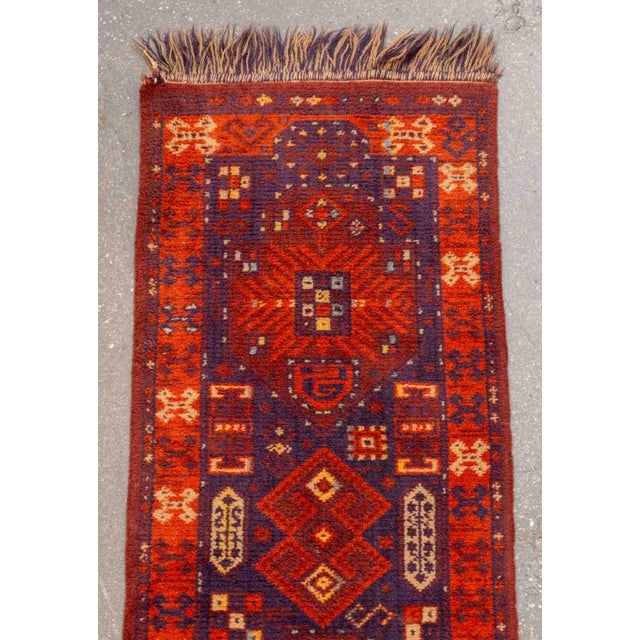 Persian Hamadan Runner, with geometric design on a red ground. 4' 9" L x 1' 3.5" W. Provenance: From a Connecticut Estate.