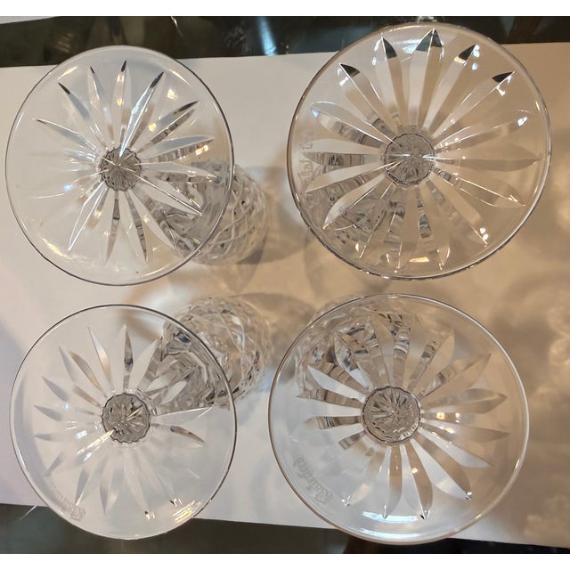 Set of 4 Waterford hand blown crystal glasses in Powerscourt pattern. Powerscourt debuted in 1969 and was discontinued in...