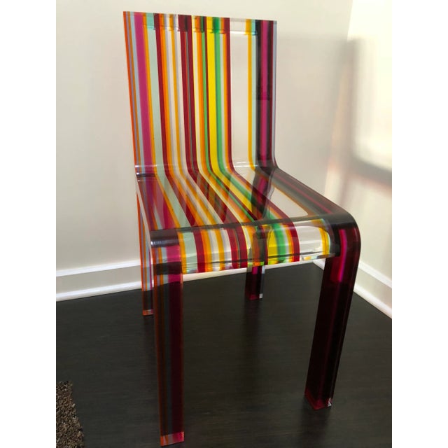 The amazing Rainbow chair by Patrick Norguet delivers an elegant shape while making a statement with bold colors. It is...