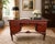 This elegant antique Louis XV Revival desk features a richly finished wood frame with beautifully figured drawer fronts,...