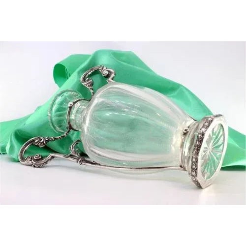 Vase in Cut Glass with Silver Structure and Applications, in Very Good conditions. Designed 1890 to 1919 This piece has an...