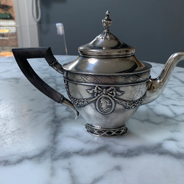 Charming small tea pot with matching creamer and sugar. The tray, which weighs 15 ounces, was purchased separately, but...
