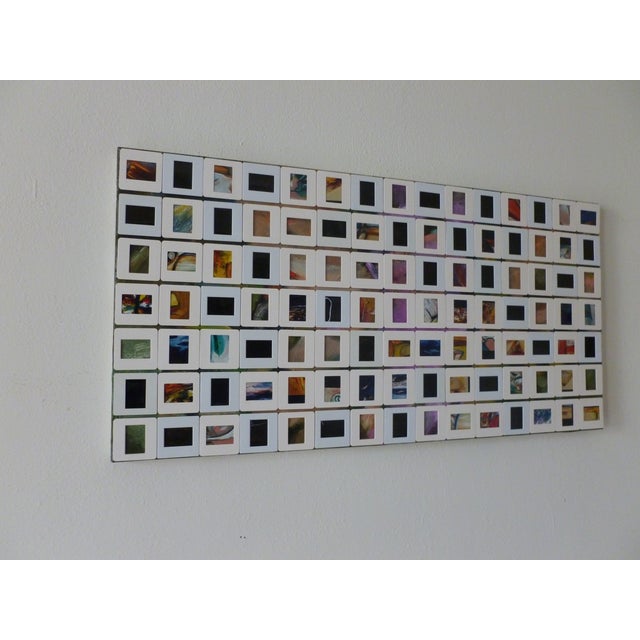 Old slides glued onto a stretched canvas with oil and acrylic paint underneath. Some slides are empty to show the painting...