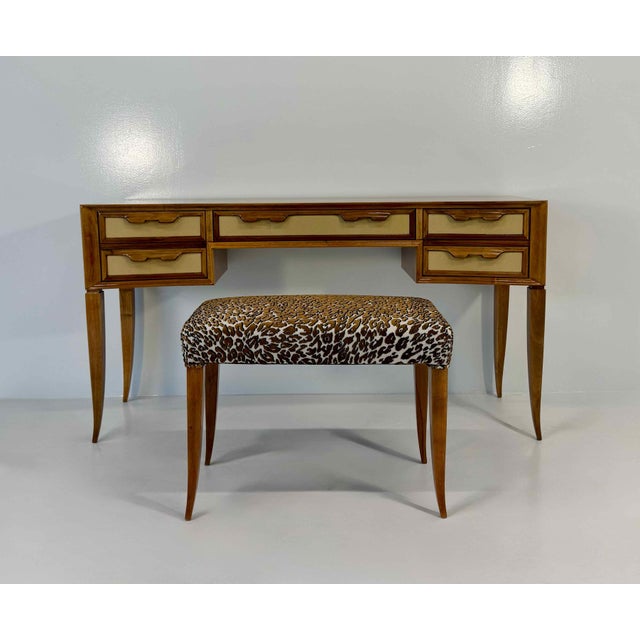 Sophisticated Italian vanity table dating from the late 1940s, accompanied by its coordinating stool. Crafted in walnut,...