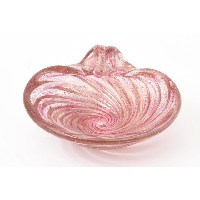 This vintage lovely small Murano glass bowl is of a colied snail form. It has swirls of of gold aventurine with light...