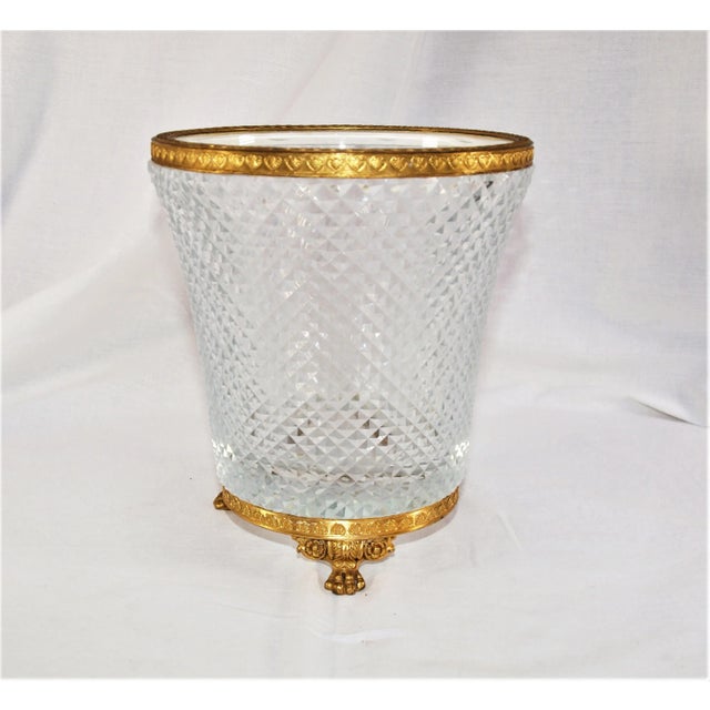 A French Regency Empire Doré bronze Ormolu paw footed centerpiece with crystal insert with scalloped accents on four...