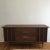 Beautifully finished solid walnut credenza with a boomerang top. The top surface cuts inward in the center. It has its...