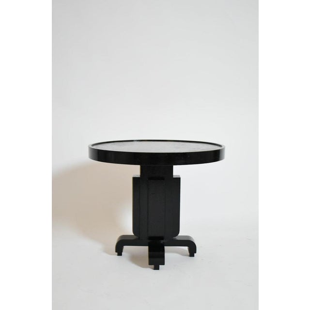 Round ebonised art deco geometric side table, 1930s. Round Art Deco pedestal table in ebonised wood with a geometric...
