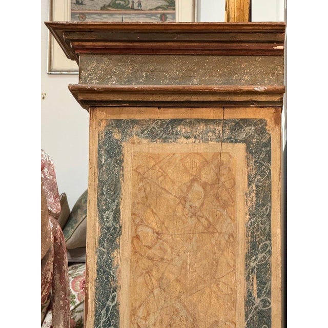 18th Century Italian armoire, Tuscany, of elegant architectural form, with a molded cornice above two doors. The facade...