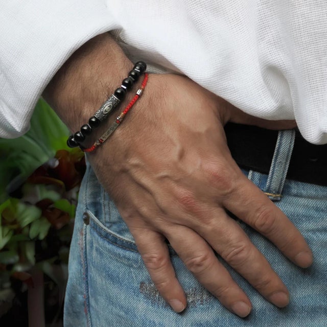 Black Onyx & Sterling Silver Unique Evil Eye Symbol Beaded Bracelet is a powerful and protective accessory designed to...