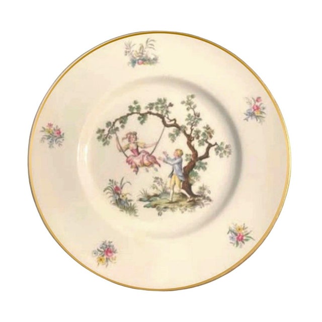 This is a set of twelve vintage 10.5” dinner plates made in England by Royal Worcester, featuring a beautiful pastoral...