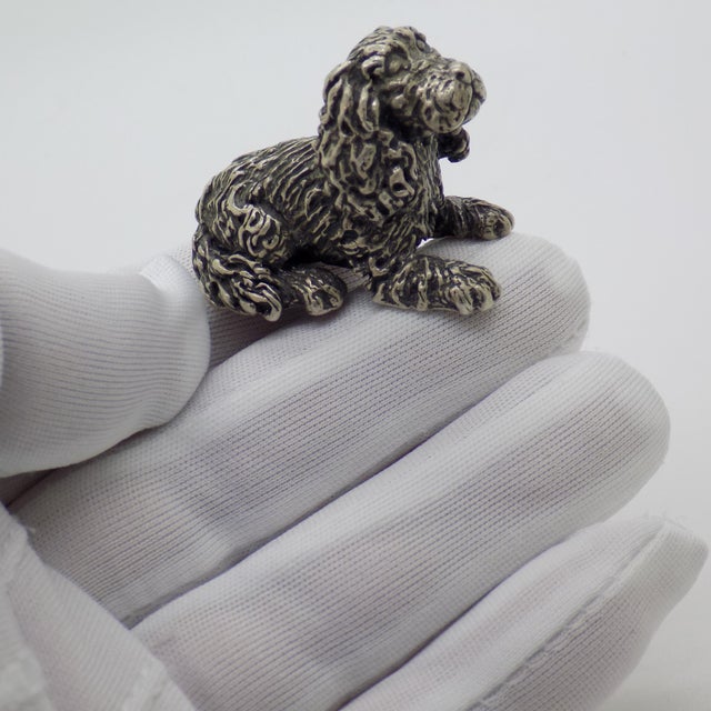 A charming and grounded vintage piece, this Italian handmade figurine depicts a sitting dog crafted in solid silver with a...