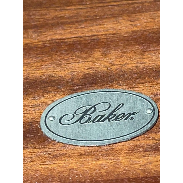 Barbara Barry for Baker Furniture console table. Features a breakfront shape, lower shelf and long tapered saber legs....