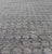 Measures 6'7 x 9'10 The field is rendered in a rich, mature light gray, with blends of neutrals creating a nice balance...