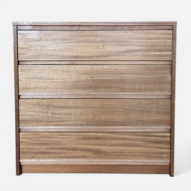 A beautifully simple mid century teak chest of drawers by Home Charm, showcasing clean lines and a timeless minimalist...