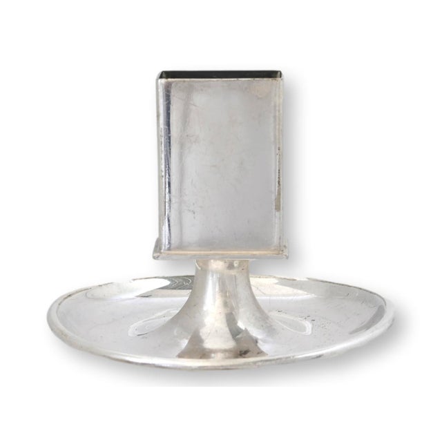 An antique Elkington silverplate matchbox holder and ashtray made for London's famed Cafe Royal. Produced in the heavy...