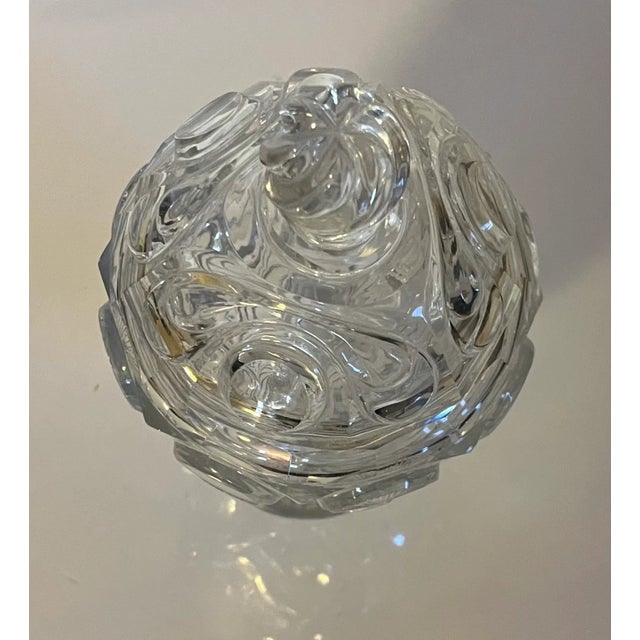 Antique 19th century French cut crystal urn and cover. Profusely decorated in a swirl pattern. Measures 8 1/4" tall x 4...