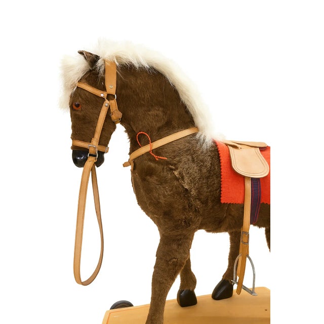Charming 1940s German-made plush pony by Meier Spielwaren Co., featuring natural animal hair, a real leather saddle and...