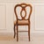 This chair belongs to the Louis Philippe style and likely originated around 1860 within the context of bourgeois home...