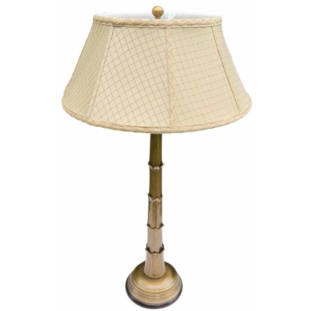 Vintage Frederick Cooper table lamp featuring a tall brass bamboo-form column with a stepped circular base and torchère-...