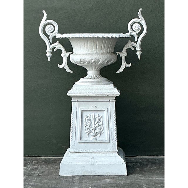This majestic vintage garden urn on a matching pedestal is a masterful example of Neoclassical and Hollywood Regency...