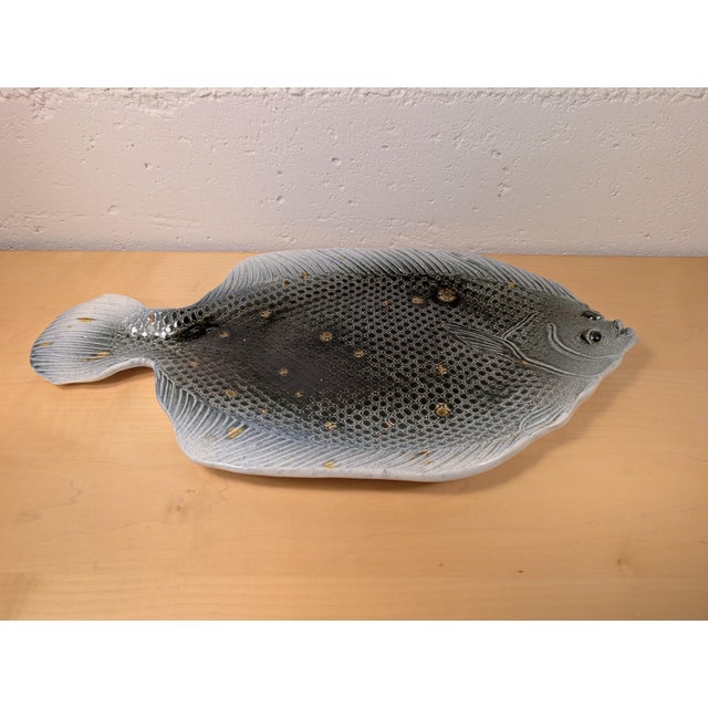 A spectacular and highly collectible 1979 studio art pottery fish platter, meticulously handcrafted by celebrated Cape Cod...