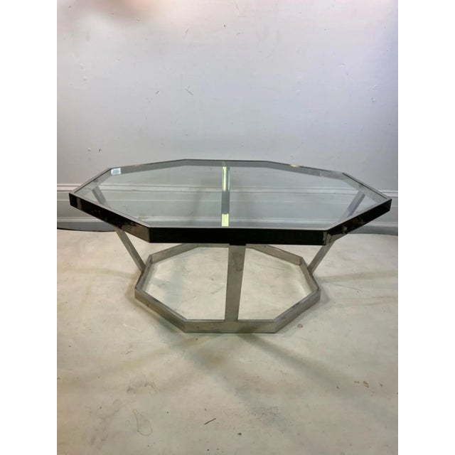 Striking Octagonal Chrome Band And Glass Coffee Table Designed by Milo Baughman in The 1970's.Measurements Of The Base are...