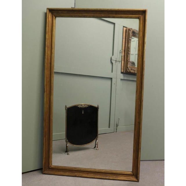 Tall French Rectangular Mirror with Aged Gilt Frame The Mirror has a very attractive simple moulded 3” wide Frame, this...