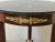 French Late 19th-Century empire style mahogany side table with marble top and bronze accents. Topping this magnificent...