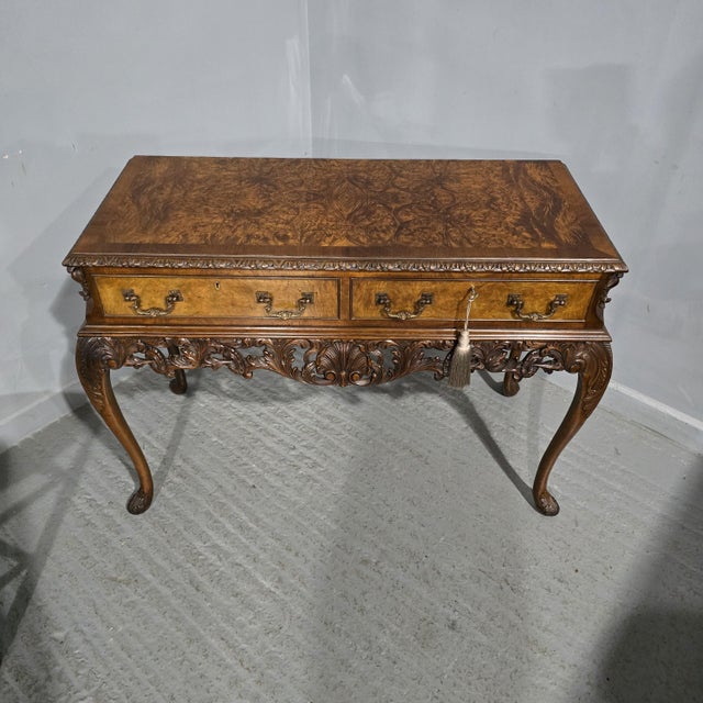A very nice Queen Anne style burr walnut two drawer sidetable, with stunning carved apron and legs, brass swan necked...