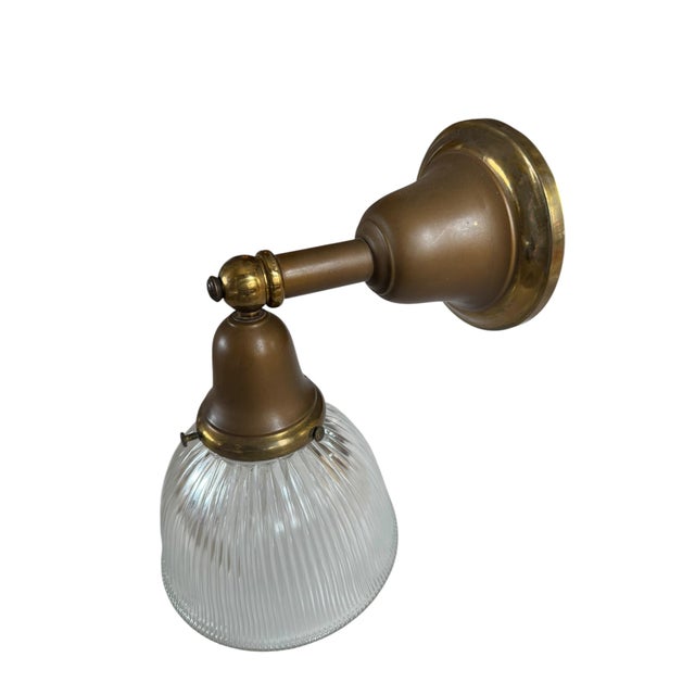 This wall sconce will look great in any room of the house. Pairs well with any type of architecture. Antique brass with...