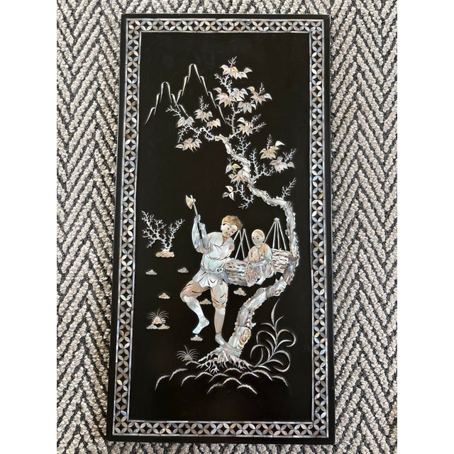 This elegant set of four mid-20th century Chinese lacquer panels depicts traditional pastoral scenes—fishermen, water...