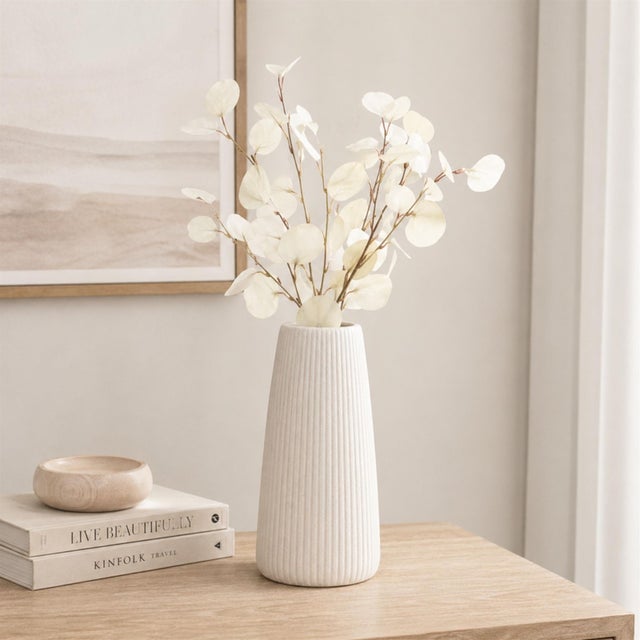 Enhance your home with the timeless beauty of the Ivory Silver Dollar Eucalyptus Leaf Sprays. This collection of faux...