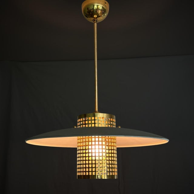 A rare Swedish pendant fixture, model 54449, produced by the renowned lighting manufacturer Malmö Metallvarufabrik in the...