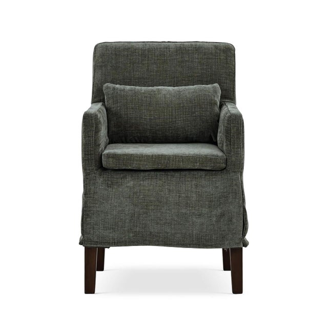The dining armchair in green upholstery is a perfect blend of timeless elegance and modern functionality. This relaxed...