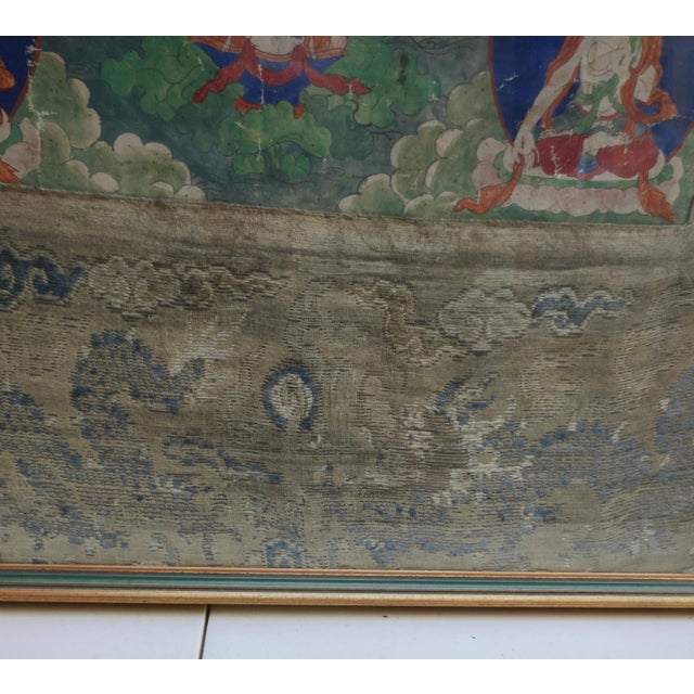 Antique Tibetan tanka of White Tara surrounded by a pantheon of Buddhist Dieties. 18th century Chinese school tanka...