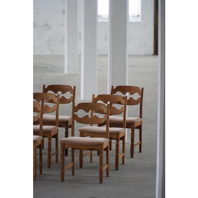 An exceptional set of 12 dining chairs designed by Henning Kjærnulf for Nyrup Møbelfabrik, Denmark, in the 1960s. Known as...
